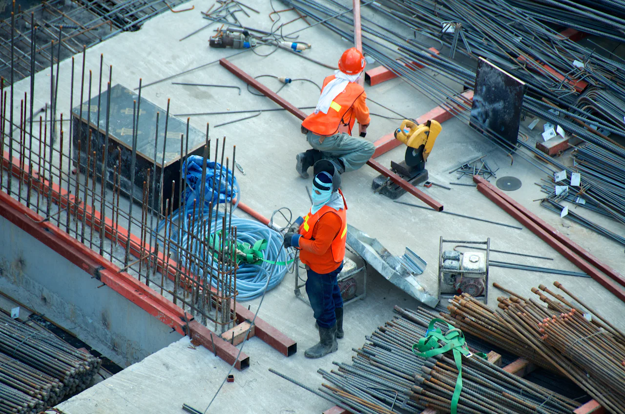 Two tradespeople working on a job site